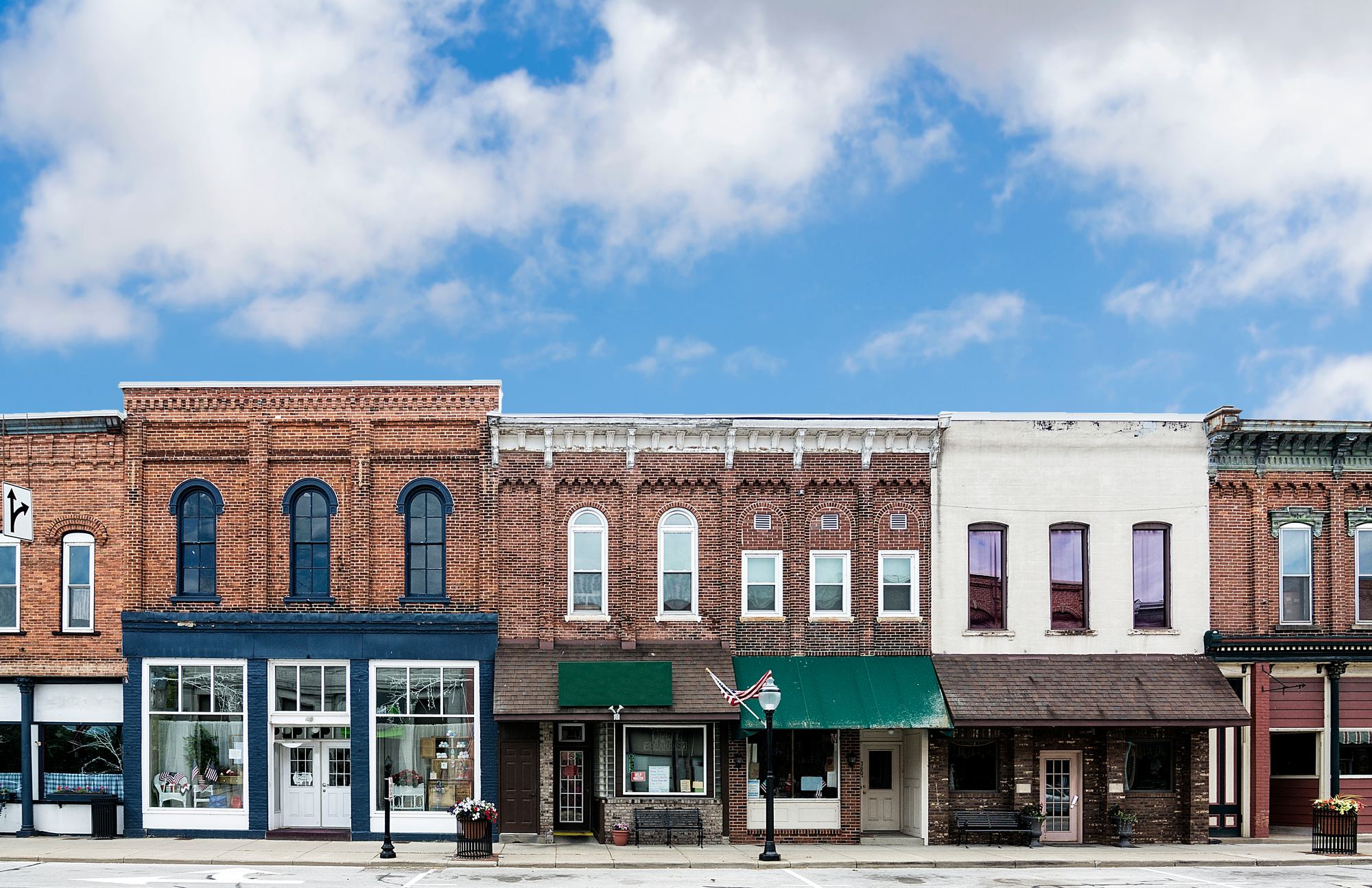 Row of historic brick storefronts on a small town main street